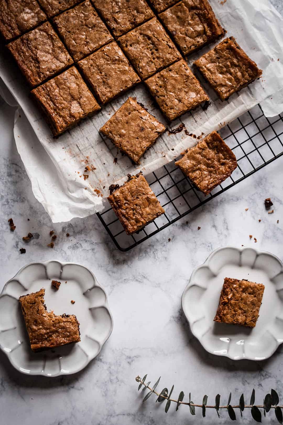 Butterscotch dark chocolate bars on a cooling rack on a marble countertop
