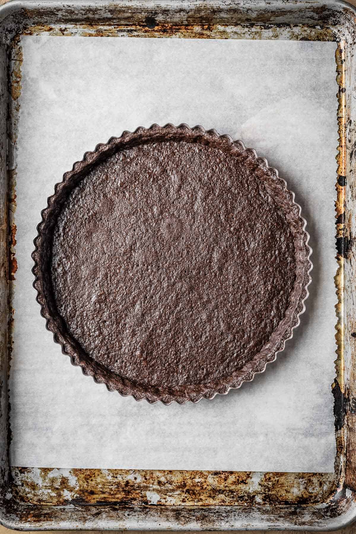 A baked chocolate tart shell.