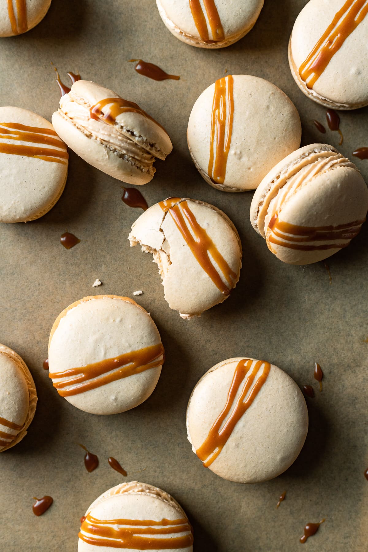Caramel macarons drizzled with caramel sauce.