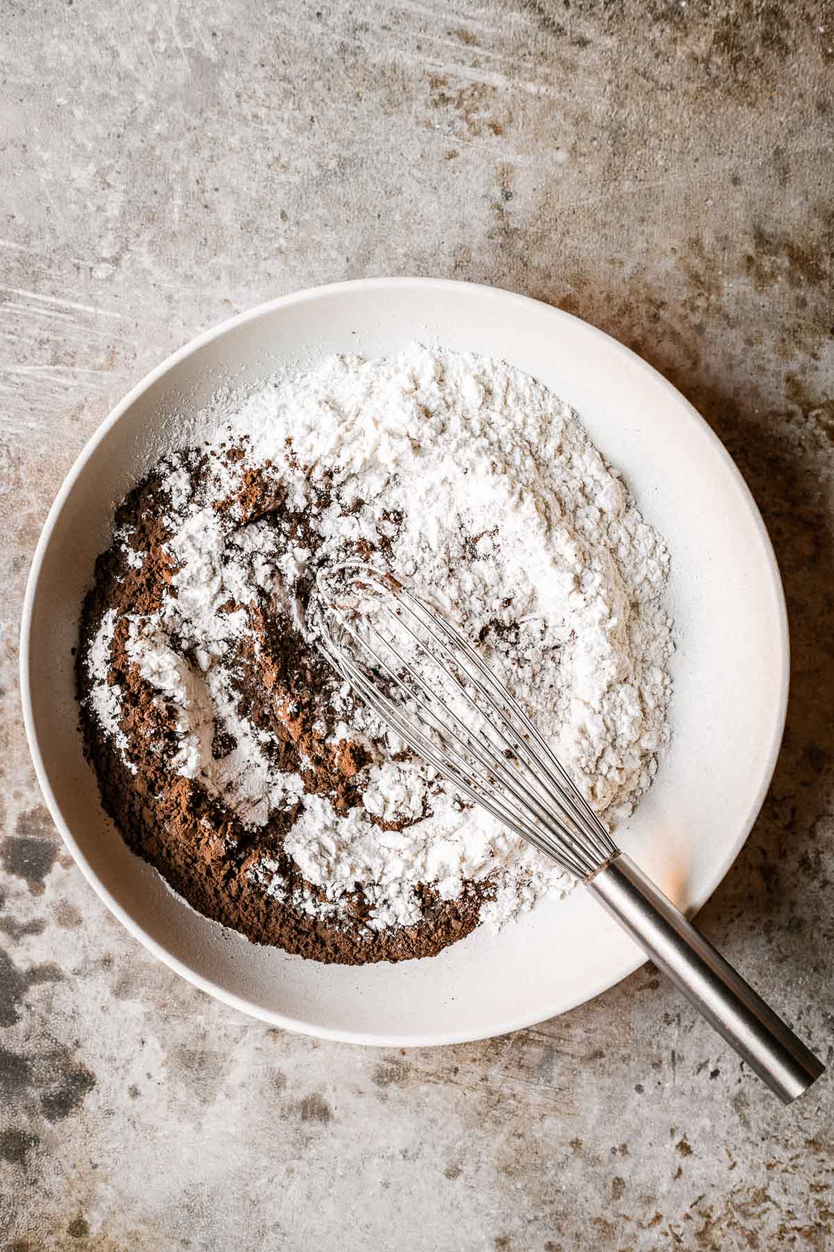 A bowl filled with dry ingredients for cookies. 