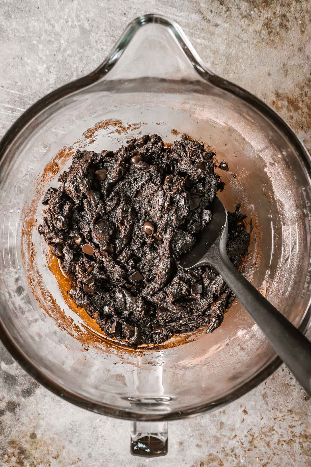 A glass bowl with finished cookie dough.
