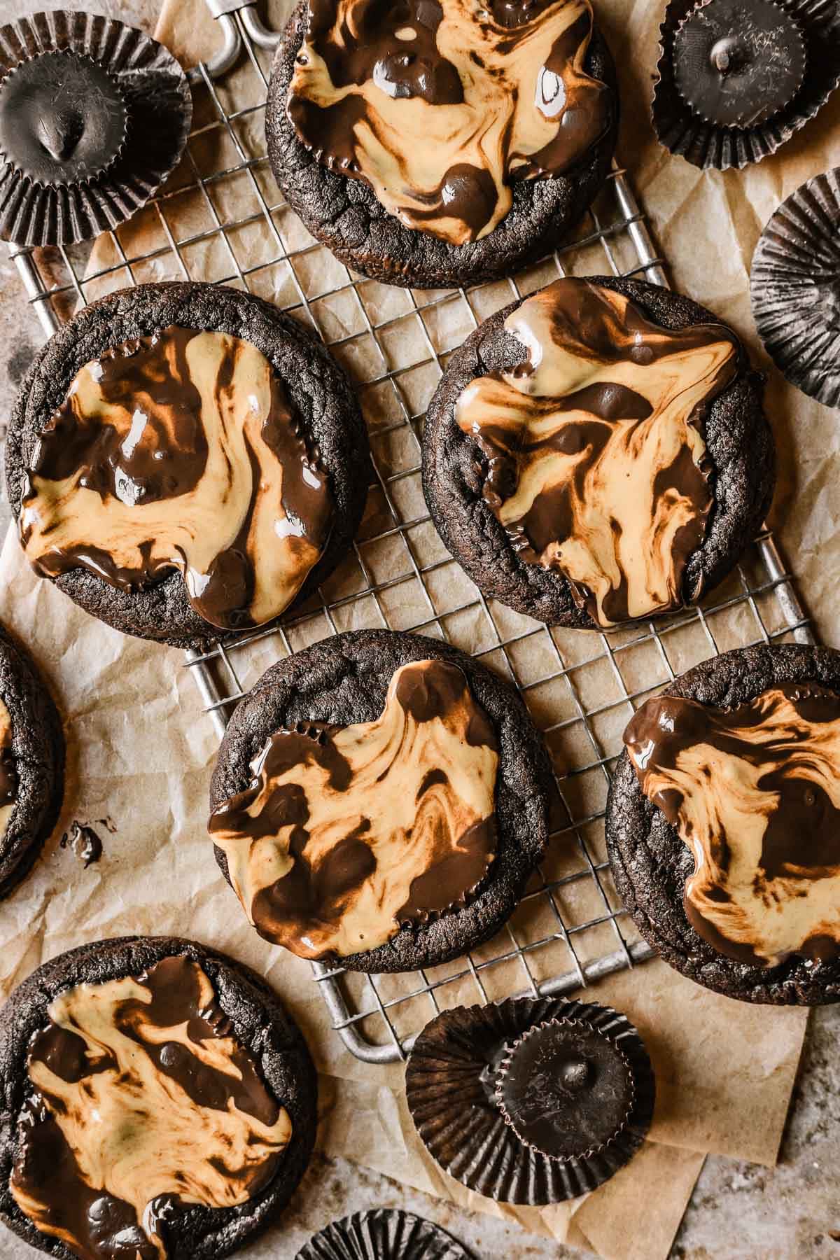 Chocolate peanut butter cup cookies on a cooling rack.