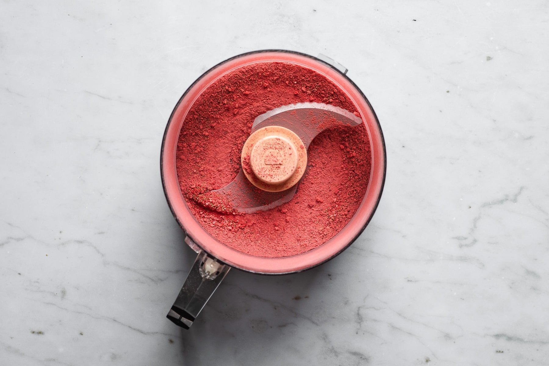 Ground up freeze dried strawberries in a food processor.