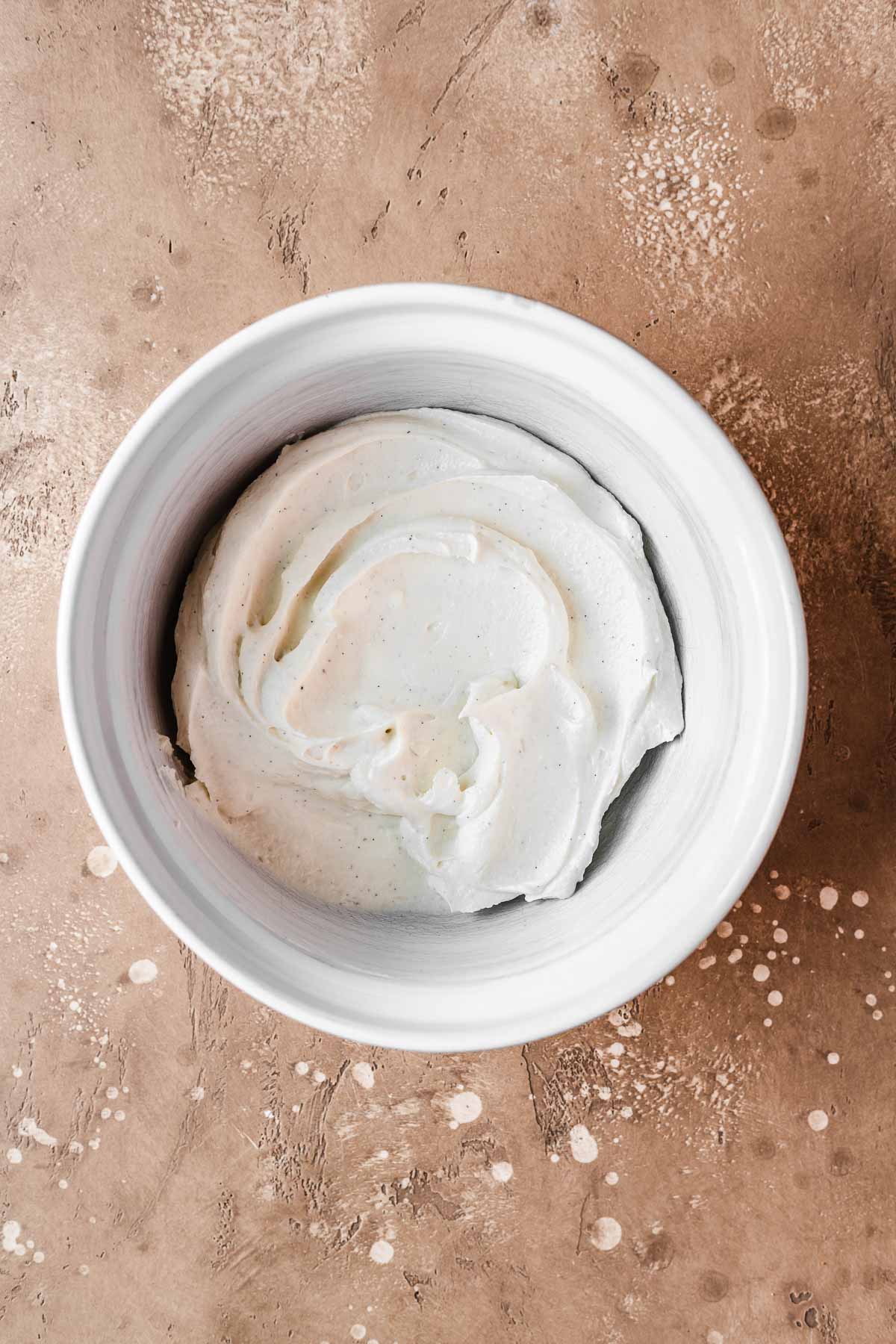 A bowl of mascarpone cream made with mascarpone and greek yogurt.