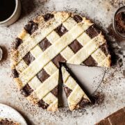 A crostata alla nutella with a few slices removed.