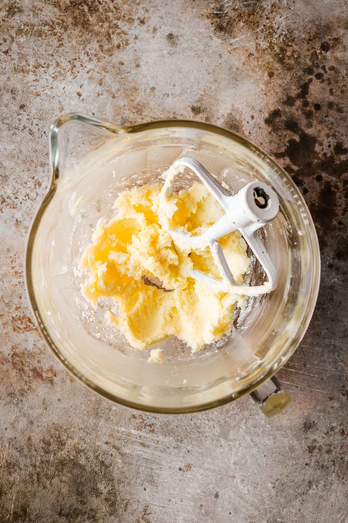 A bowl of creamed butter and sugar for crostata alla nutella dough.