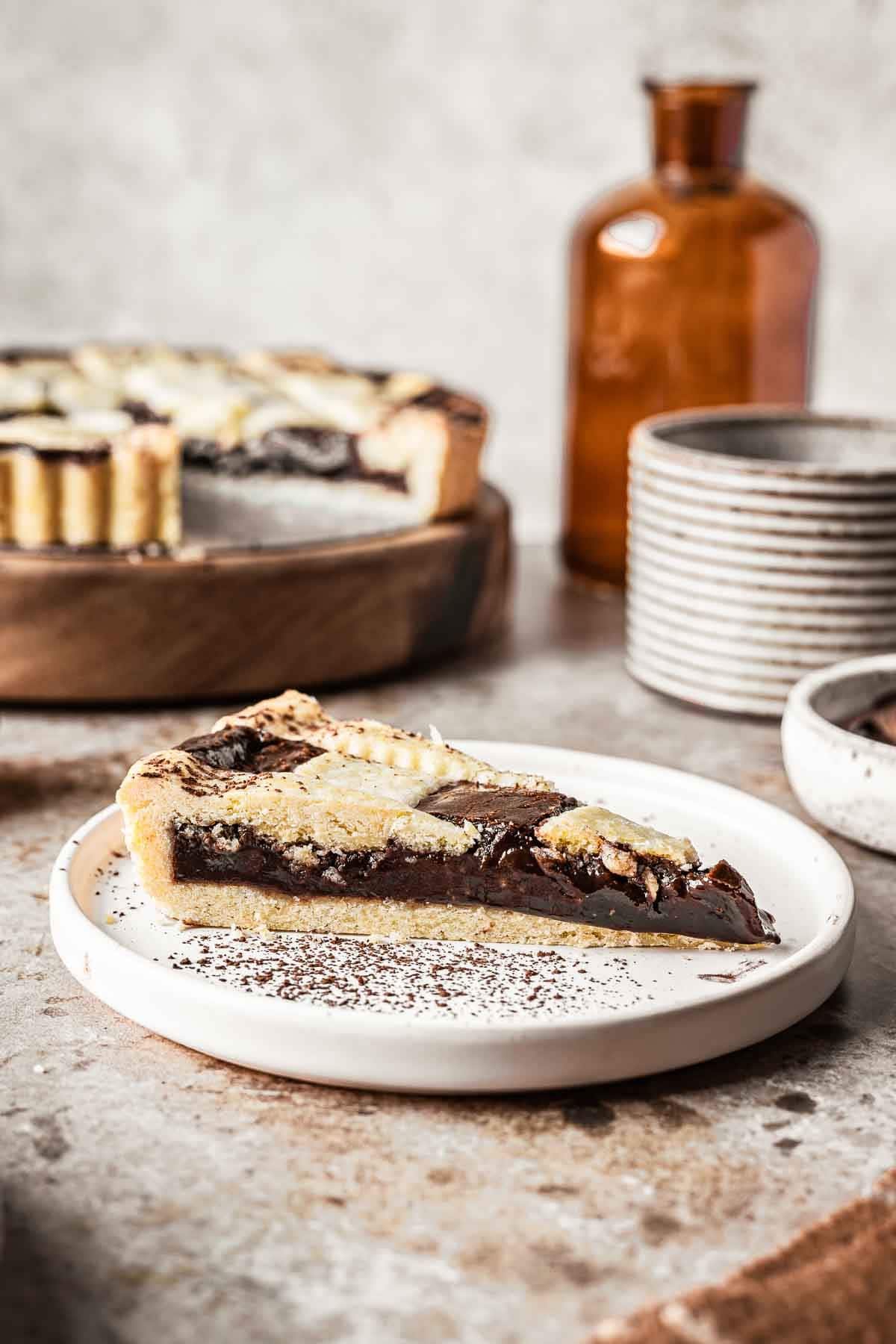 A single slice of crostata alla nutella on a white plate.