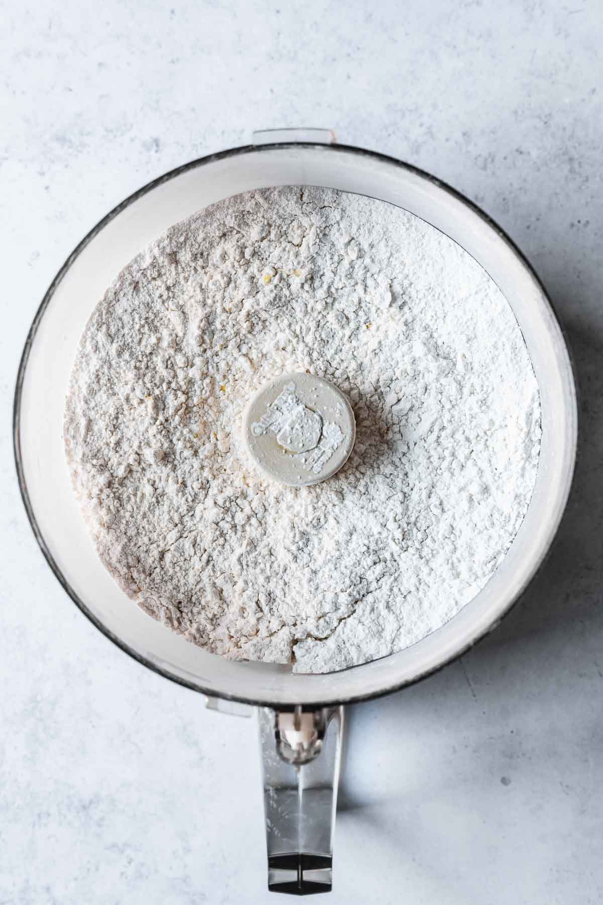 Butter cut into flour for butter cookies.