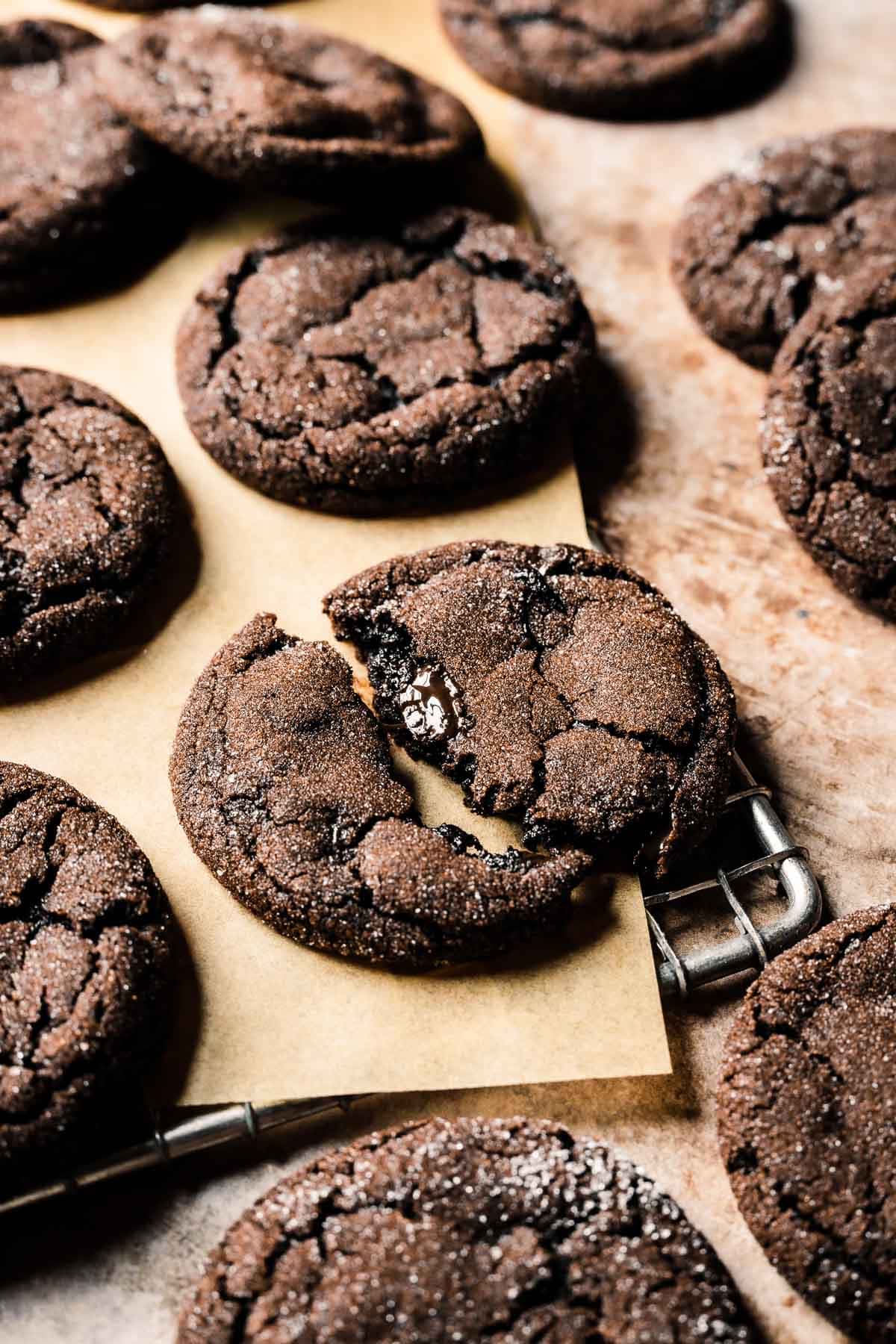 A rack of cooled chocolate gingerbread cookies.