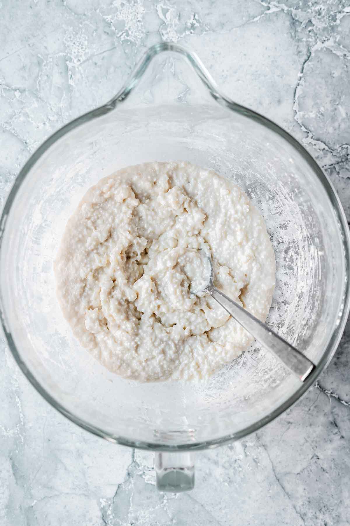 Coconut ice mixture in a mixing bowl.
