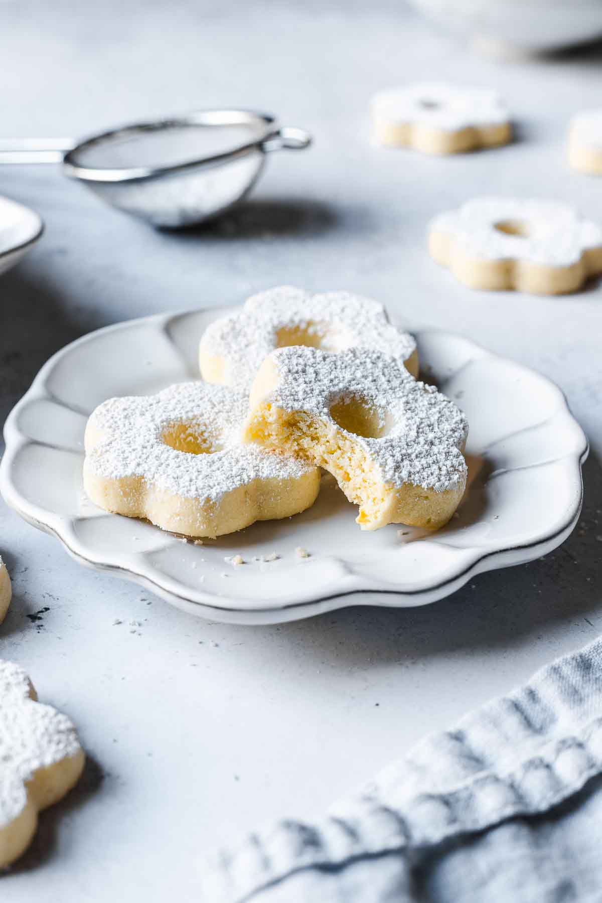 Italian shortbread cookies on a white ceramic plate.