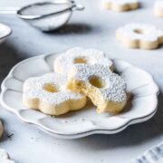 Italian shortbread cookies on a white ceramic plate.