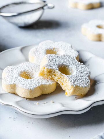 Italian shortbread cookies on a white ceramic plate.