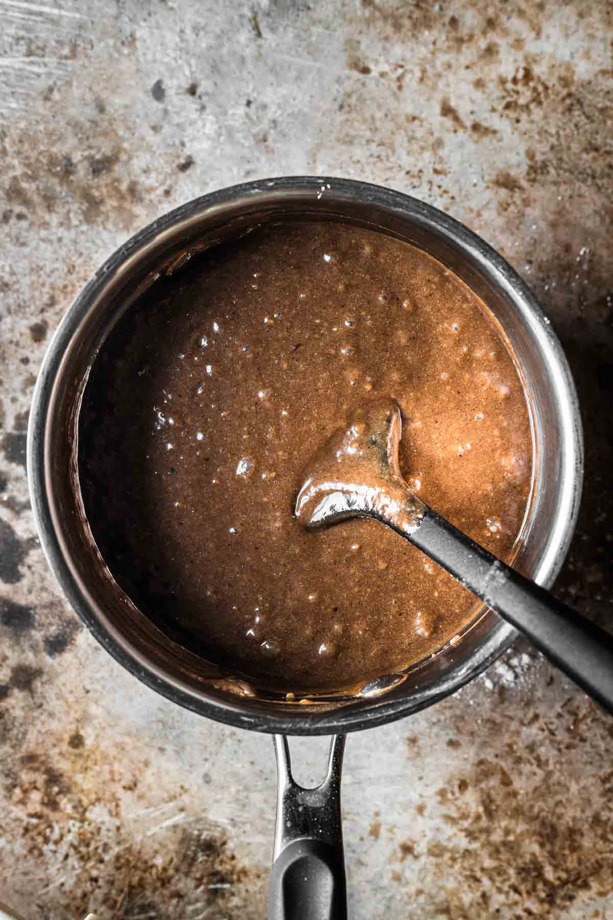 A saucepan of finished piernik cake batter.