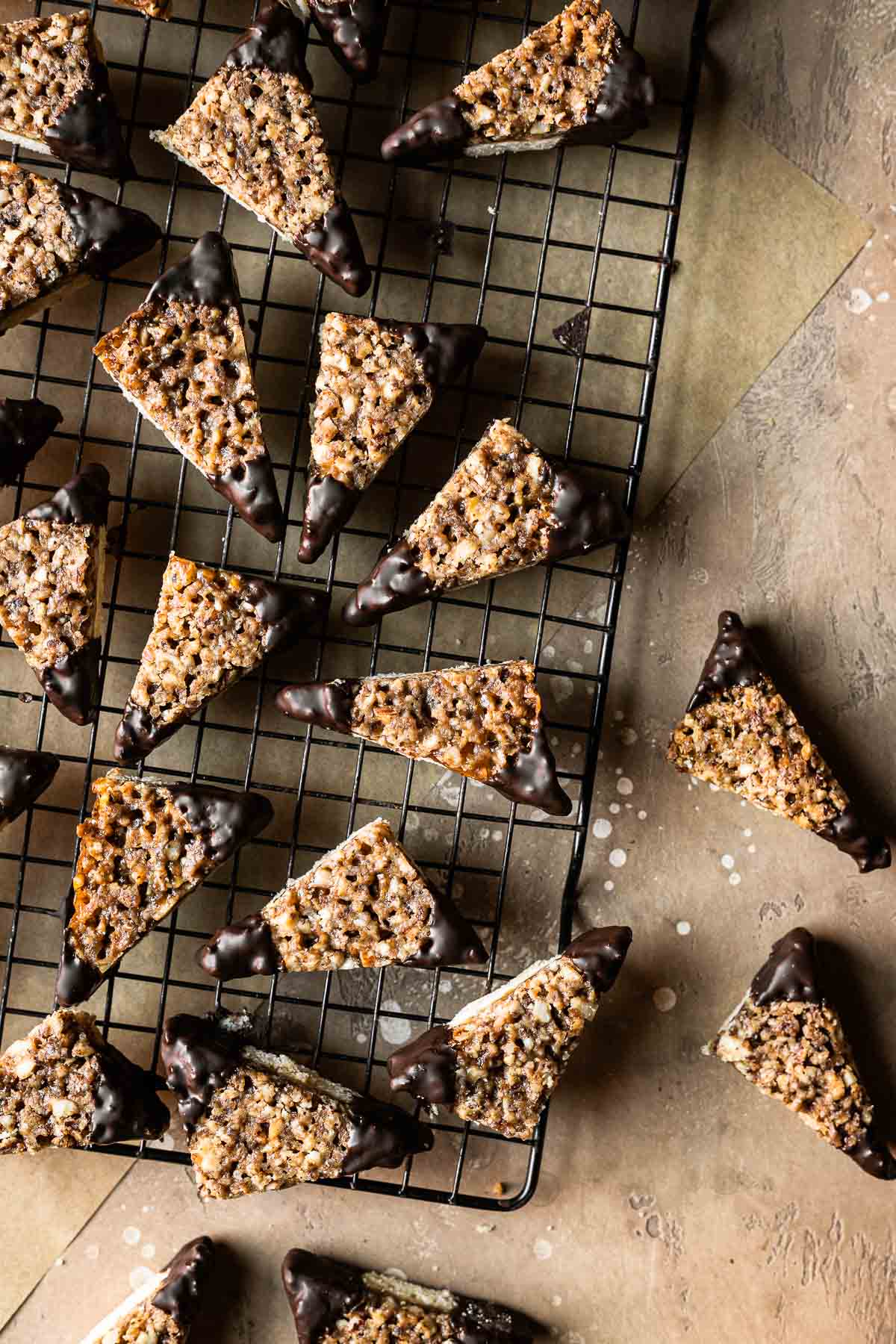 German nut corners dipped in chocolate on a cookie rack.