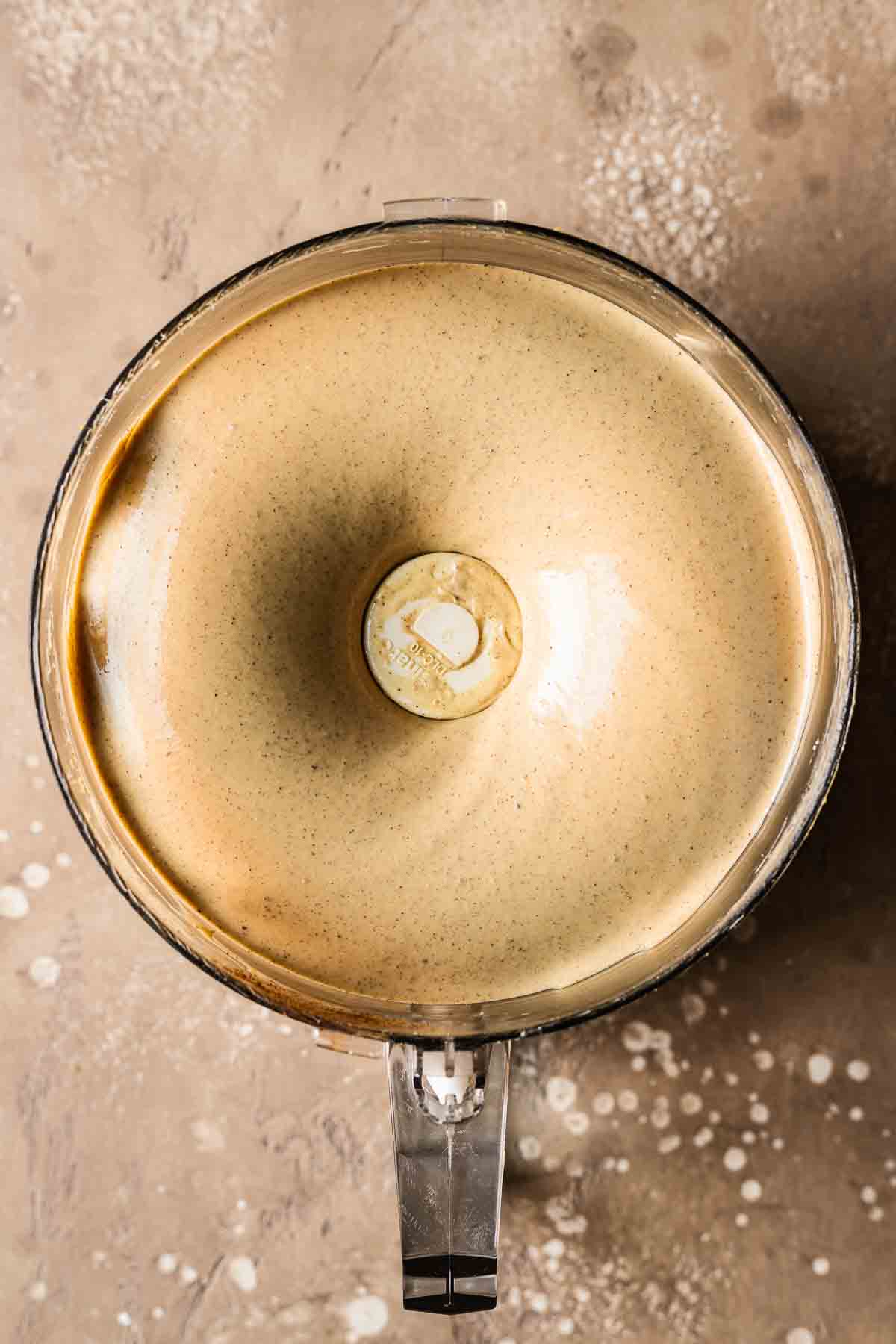 The ingredients for gingerbread cheesecake filling blended in a food processor.