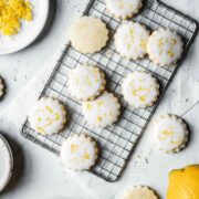 Lemon shortbread cookies with white glaze and lemon zest sprinkled on top