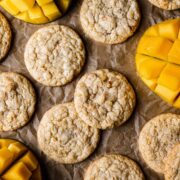 Cookies with sliced mangos peeking into the image.