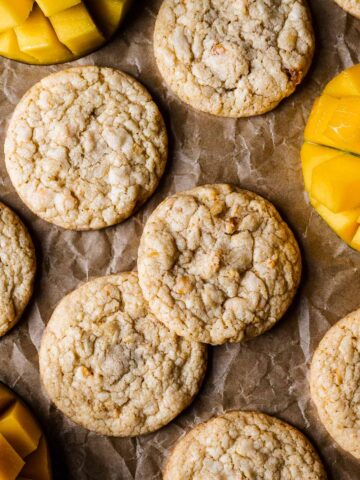 Cookies with sliced mangos peeking into the image.