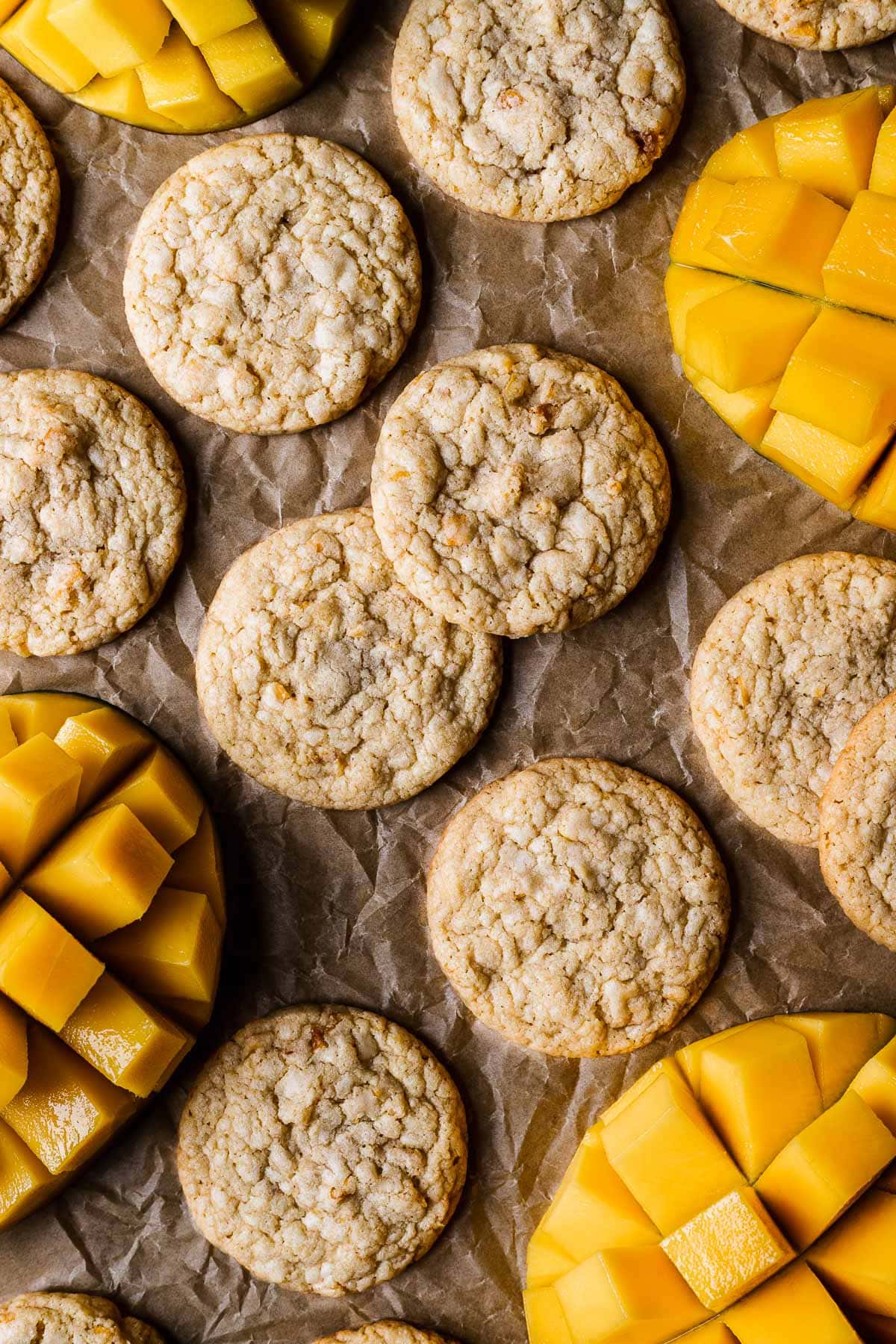 Cookies with sliced mangos peeking into the image.