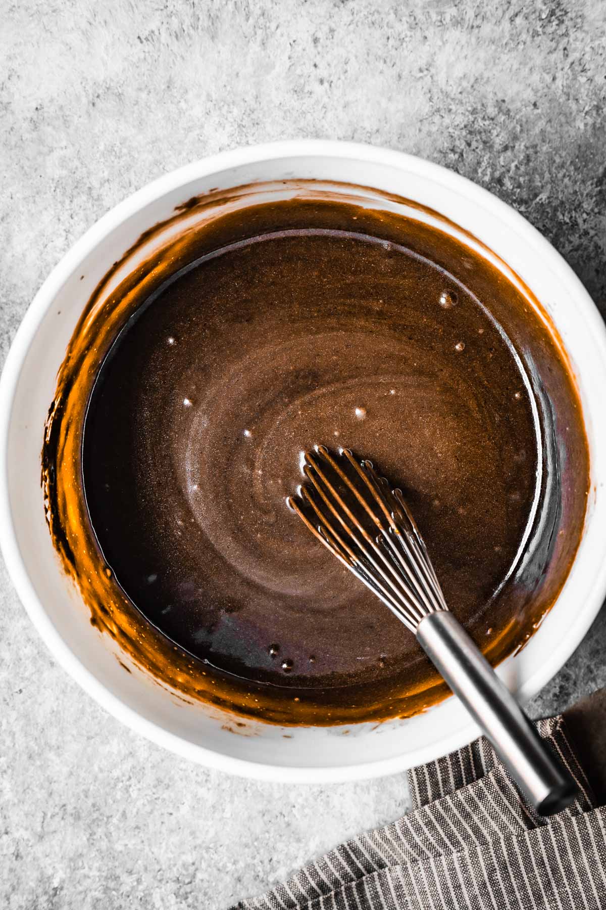 Cake batter in a white mixing bowl.