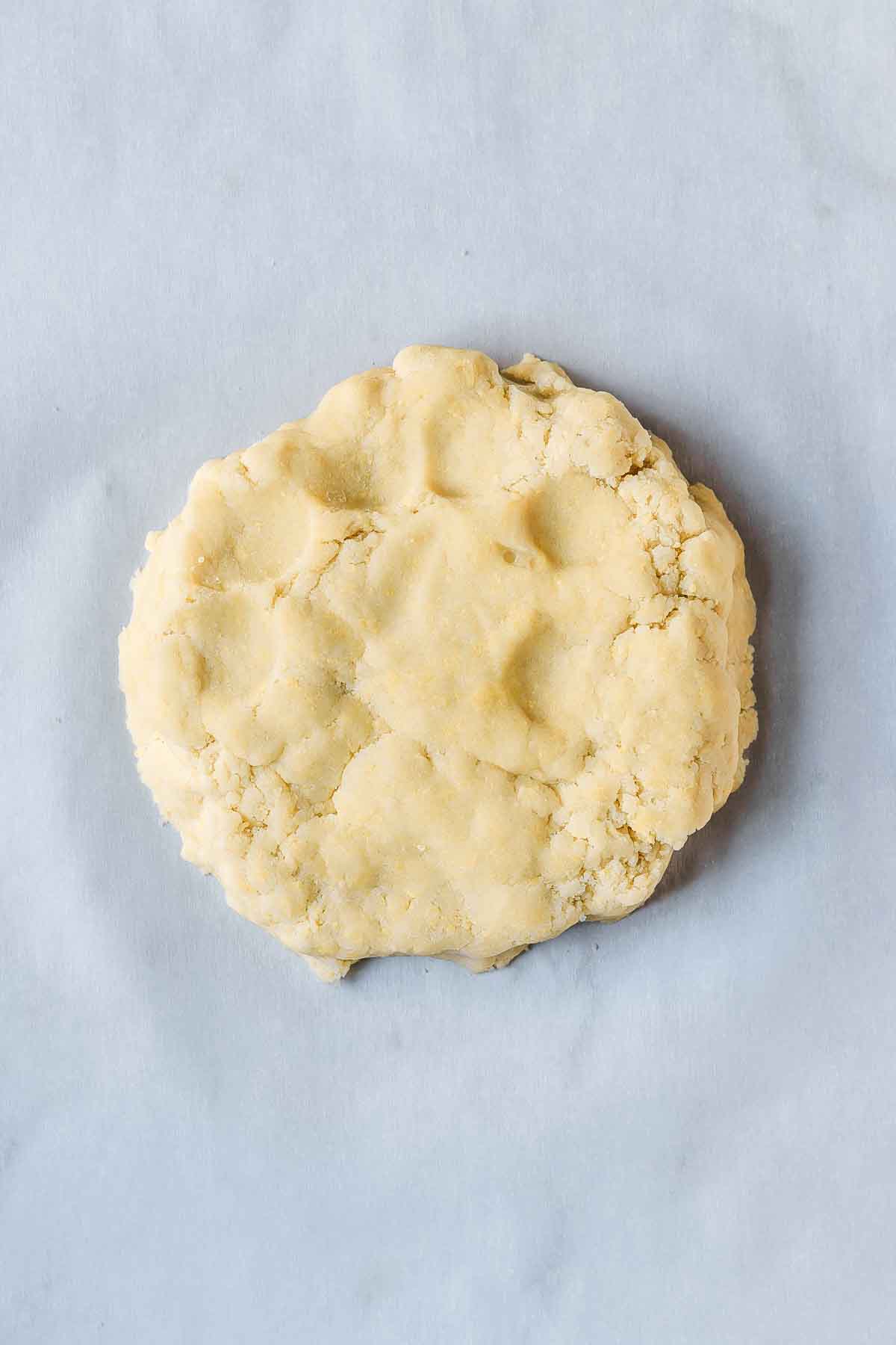 Pate sucree dough gathered into a disc.