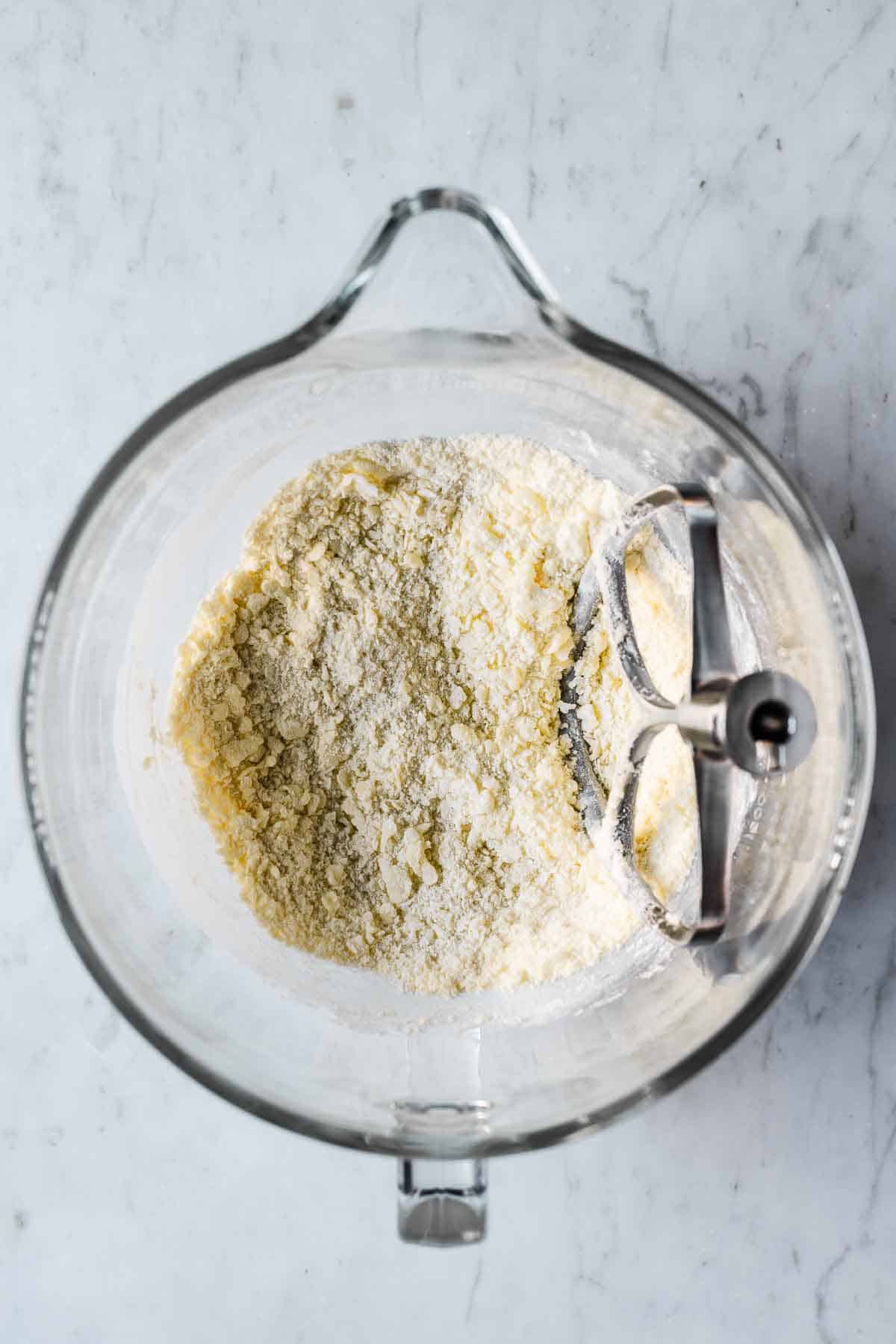 Mixing bowl with butter, sugar and flour combined.