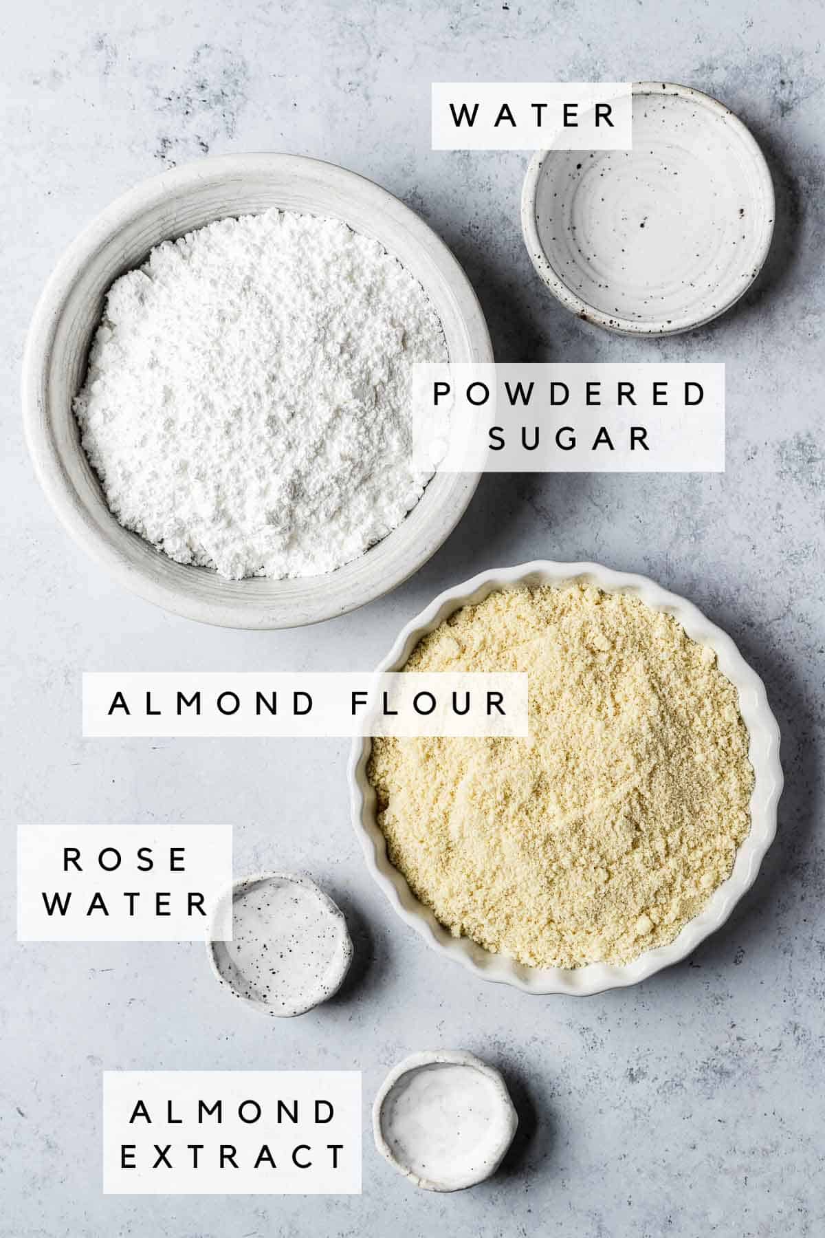 Ingredients in bowls for almond paste recipe.