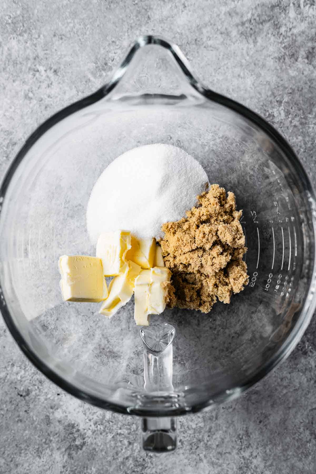 Butter and sugars in a mixing bowl.