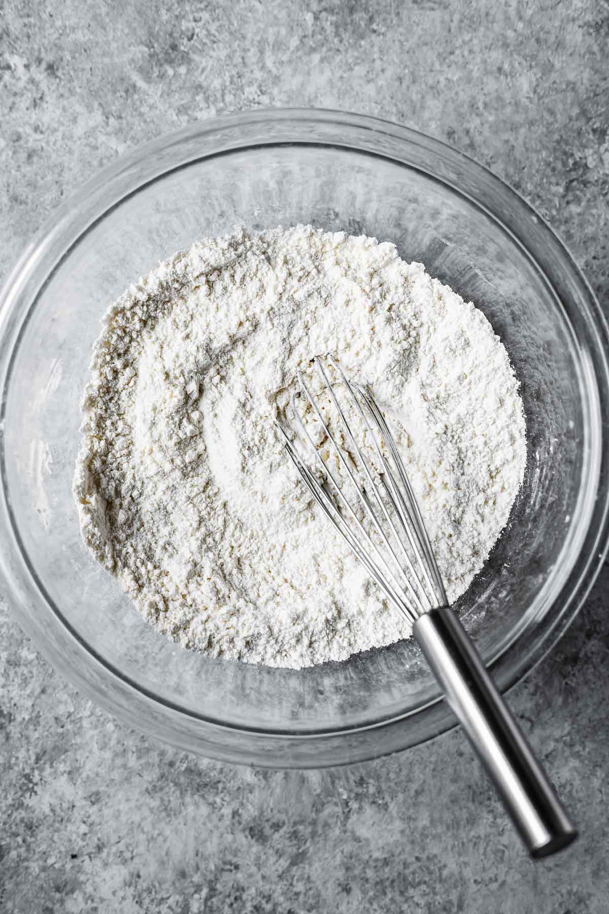 Dry ingredients whisked together in a mixing bowl.