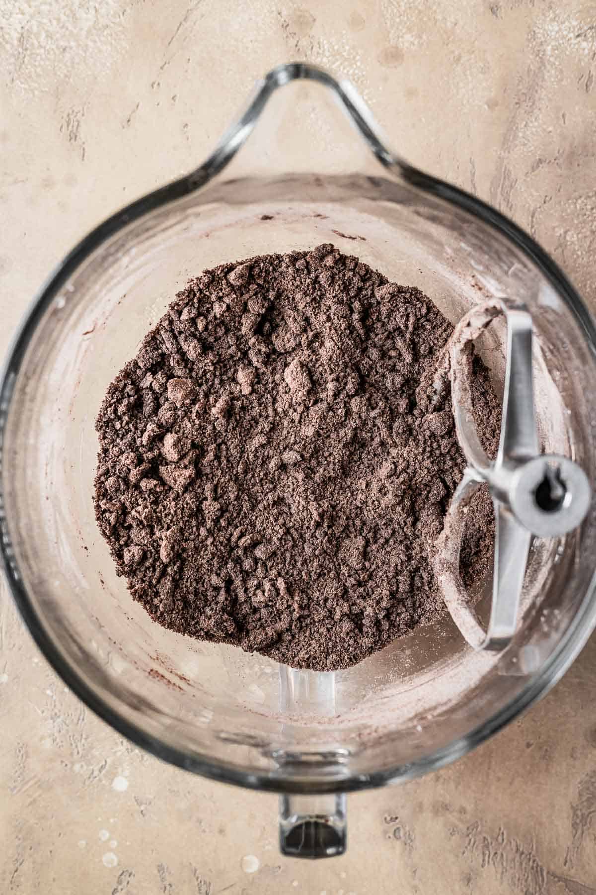 Dry ingredients blended with butter and sugar in a mixing bowl.