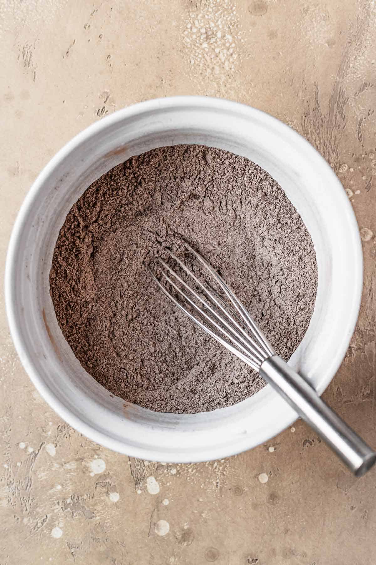 Dry ingredients whisked together in a bowl.