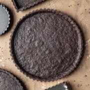 A round baked chocolate tart crust.