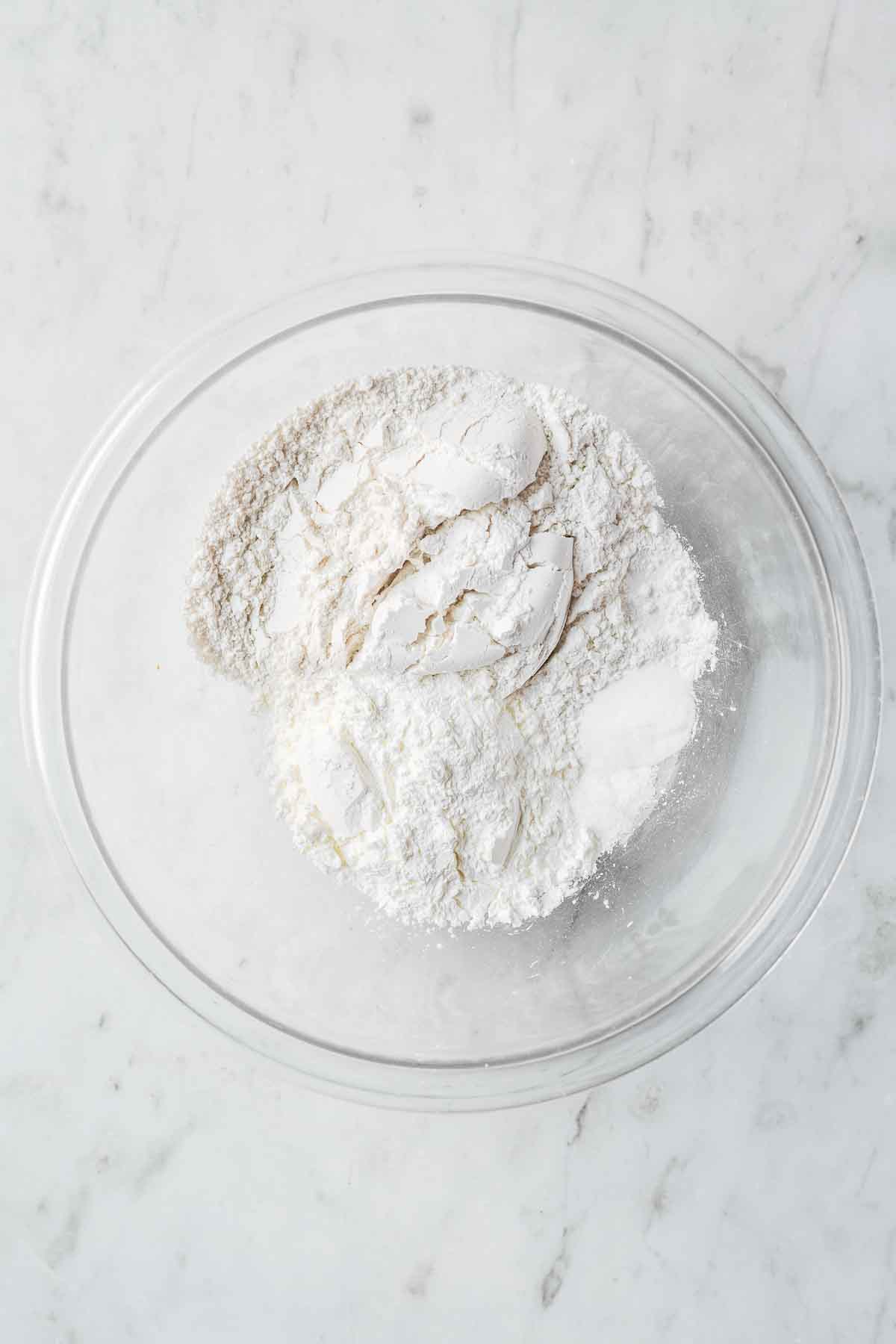 Dry ingredients in a glass mixing bowl.