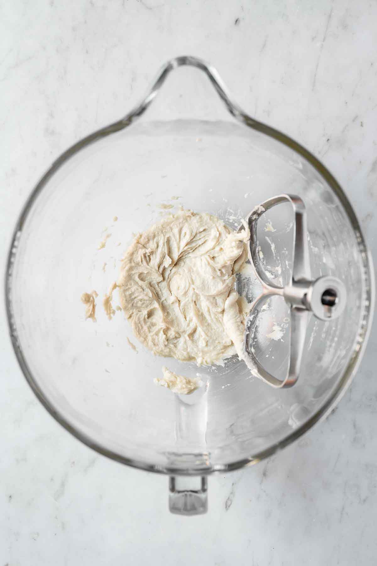 Wet ingredients mixed together in a glass mixing bowl.
