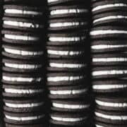 Three rows of vanilla creme filled chocolate sandwich cookies.
