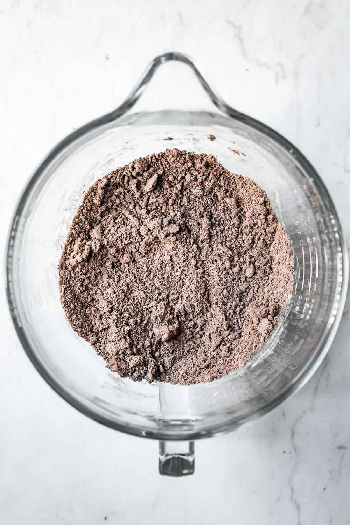 Dry ingredients added to wet for Oreo cookie dough.