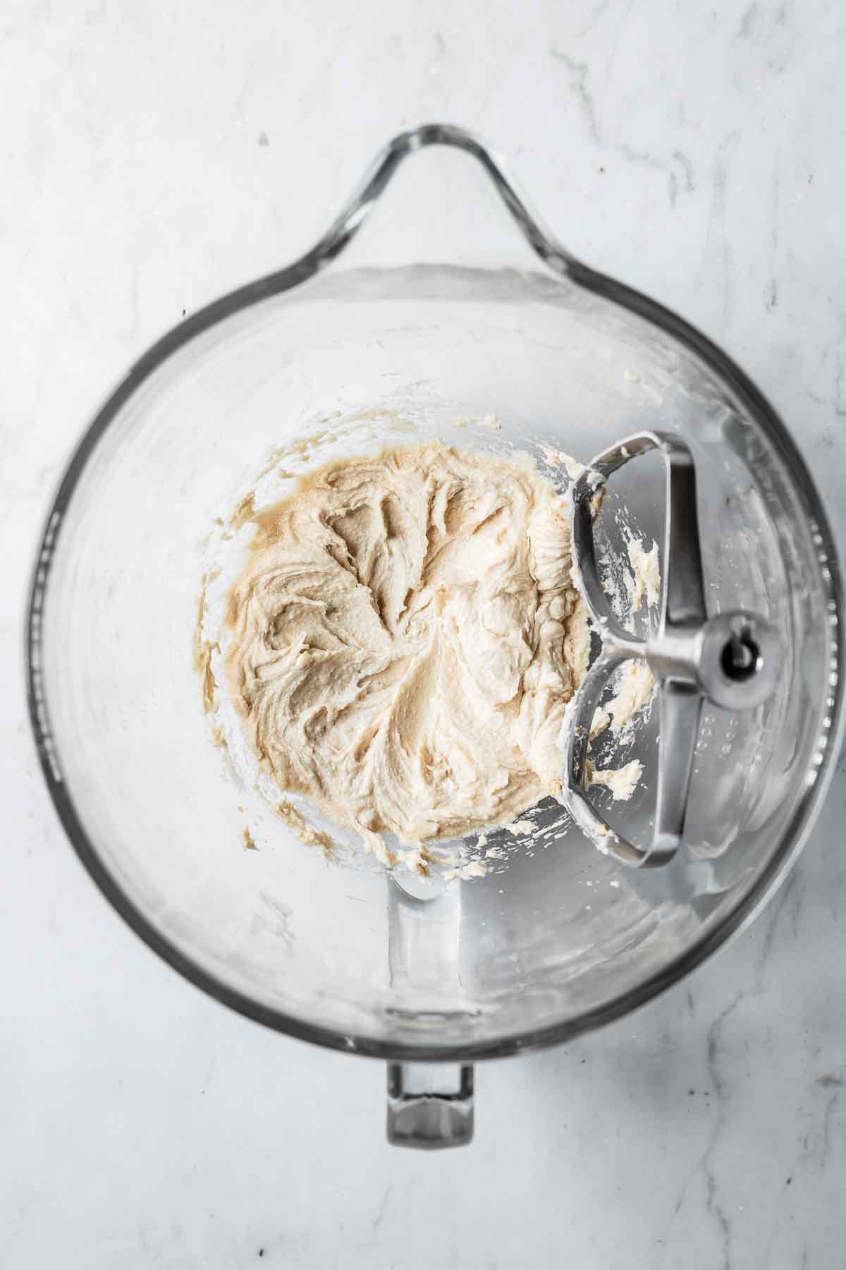 Wet ingredients in a glass mixing bowl.