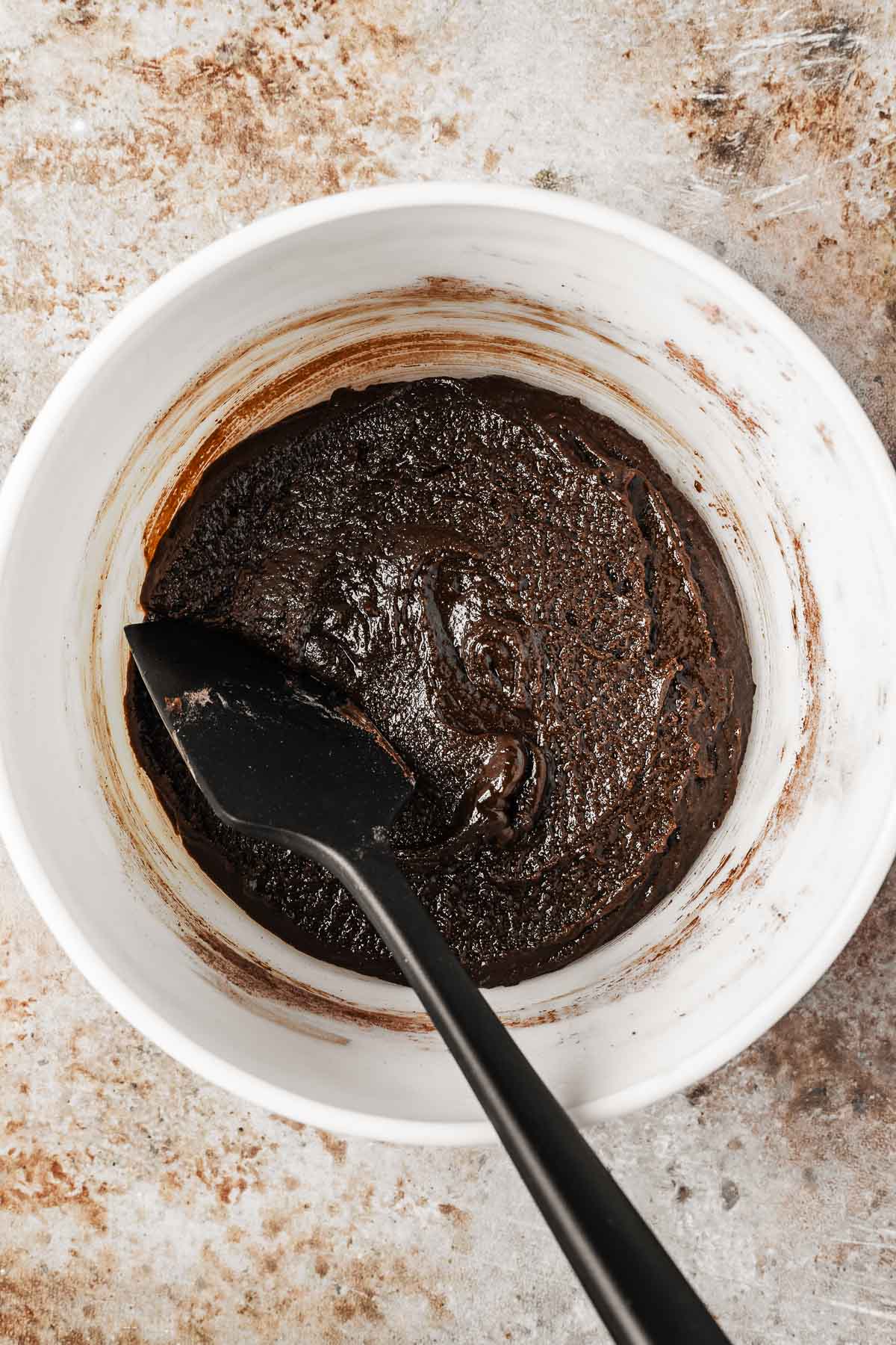 Dry ingredients mixed with wet ingredients for double chocolate chip cookie bar batter.