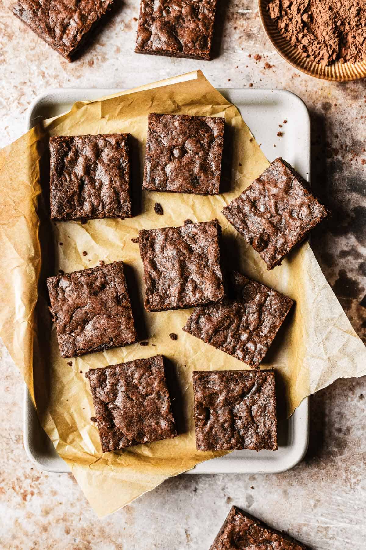 Chocolate chocolate chip cookie bars on a rectangular tray.
