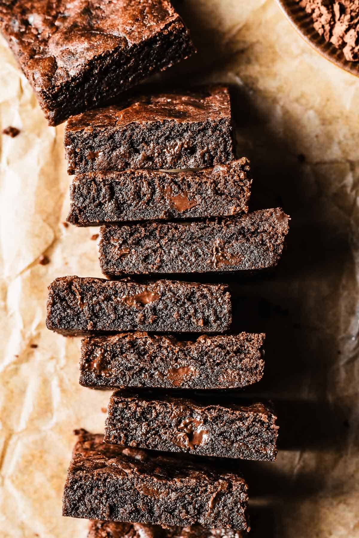 Double chocolate chip cookie bars turned on end to show the moist chewy crumb.