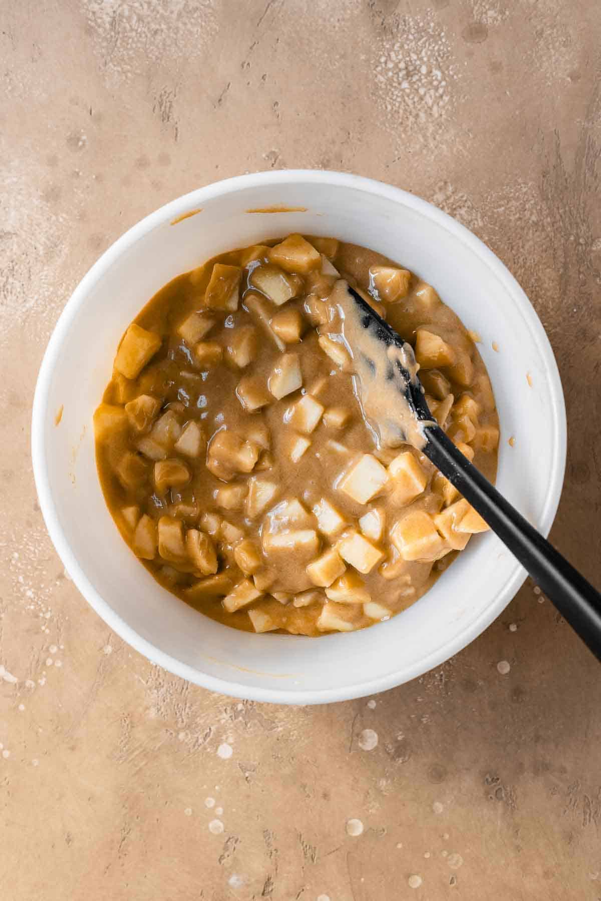 Chopped apples mixed into cake batter.