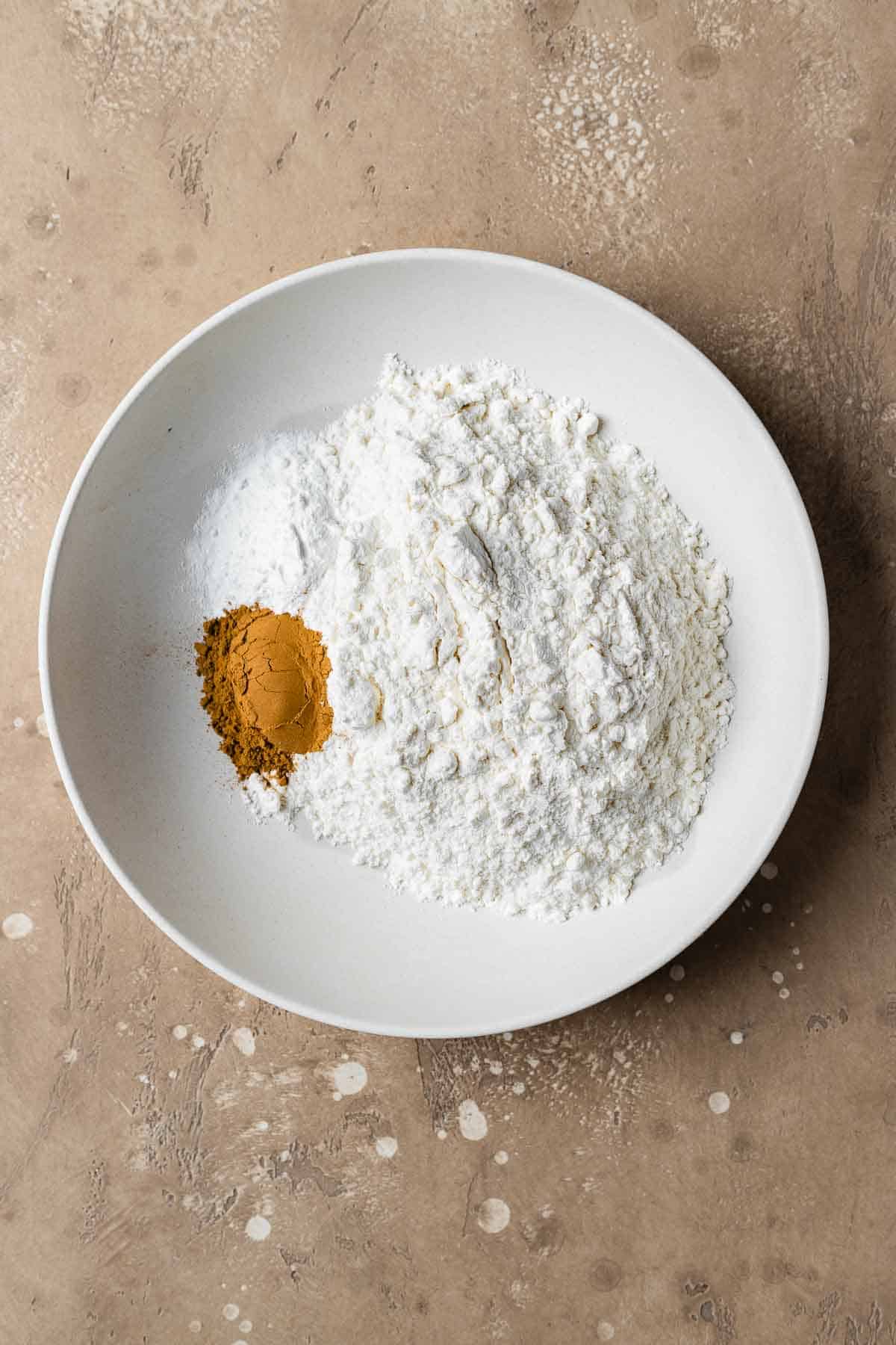 Dry ingredients in a bowl for an apple cake recipe.
