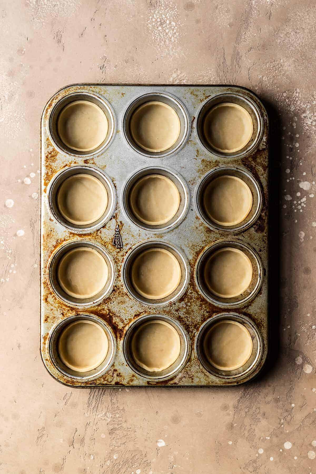 Unbaked, shaped cookie bases for nutella biscuits.