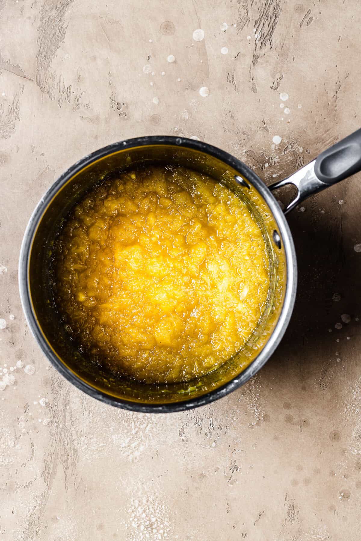 A cooked pot of fresh pineapple jam.