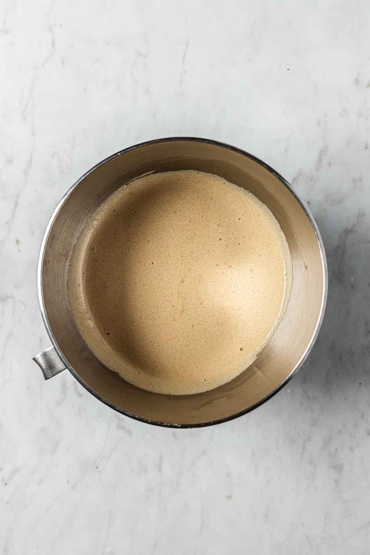 Brown sugar and egg whites in a mixing bowl.