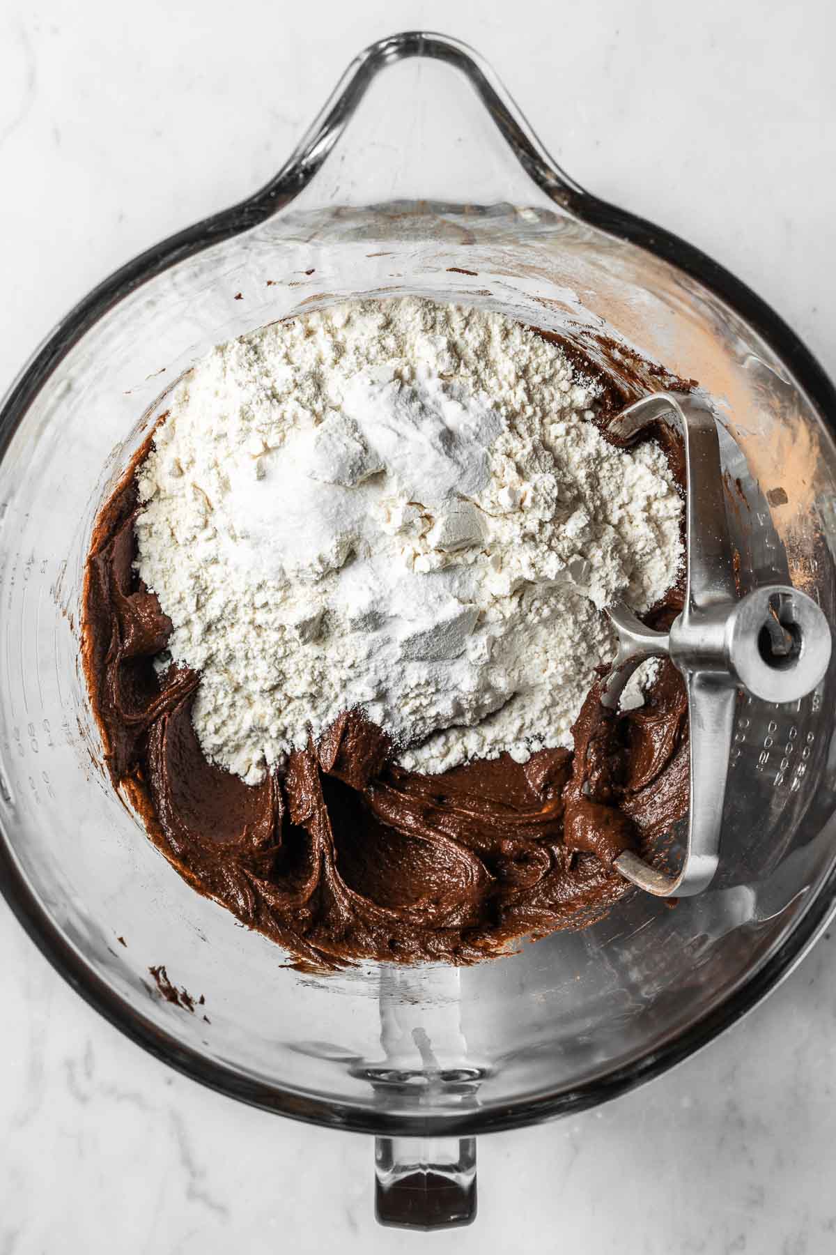 Dry ingredients added to wet chocolate cookie dough.