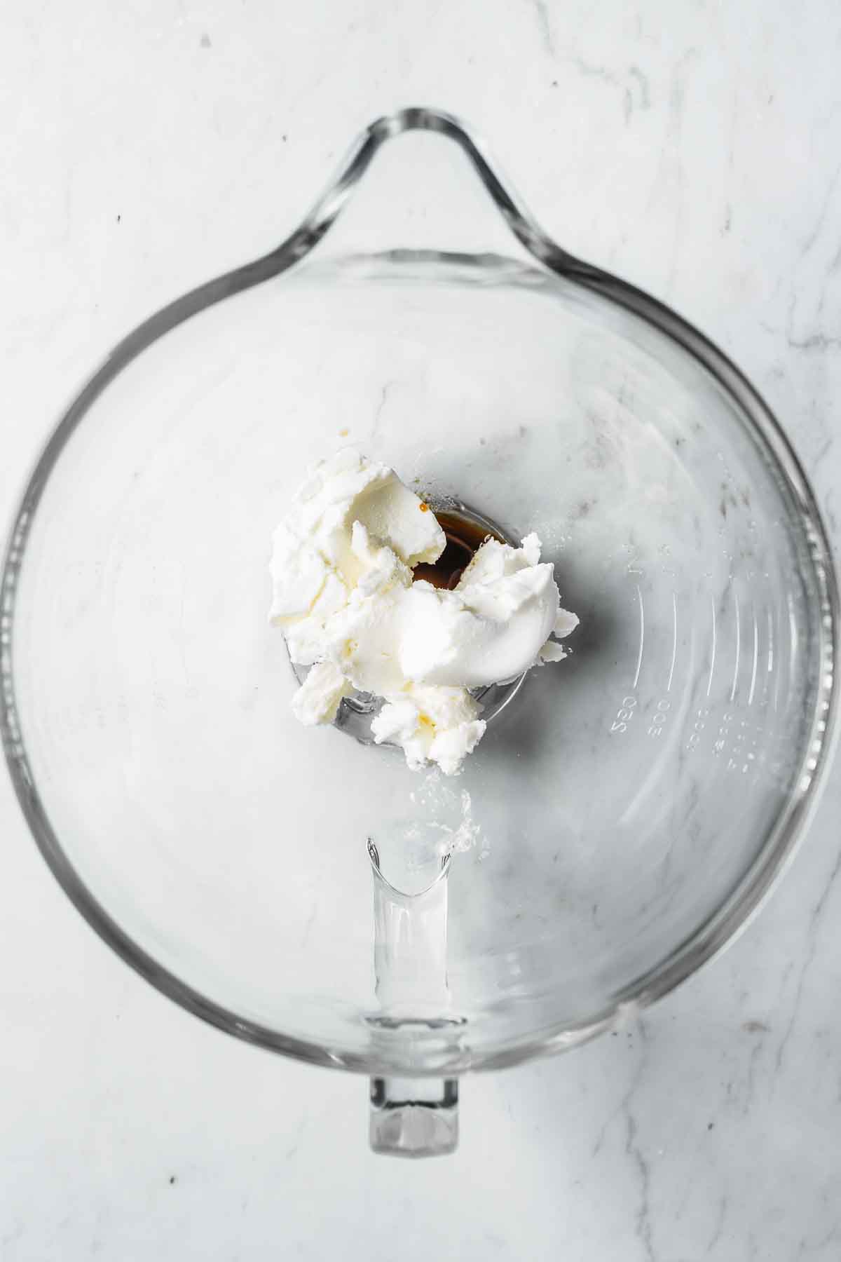 Palm shortening, corn syrup and vanilla in a glass mixing bowl.