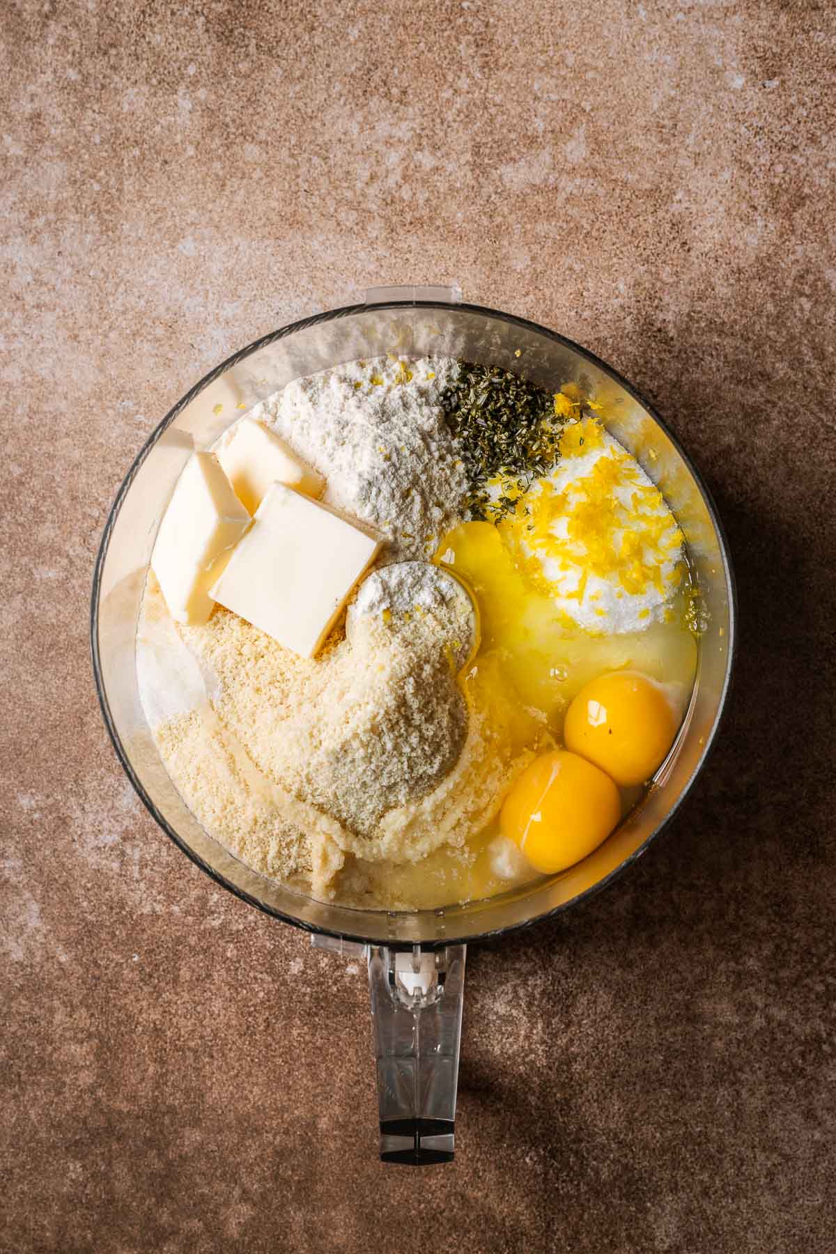 Ingredients for frangipane in the bowl of a food processor.